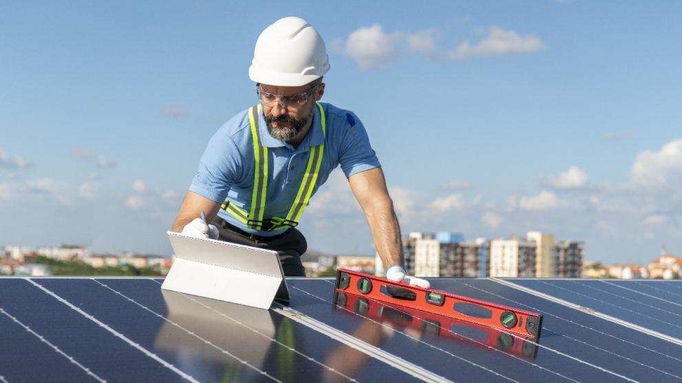 Engineer installing solar panels